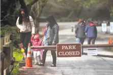  ?? Scott Strazzante / The Chronicle ?? Visitors are allowed to enter Muir Woods, but the parking lots are closed as a result of the government shutdown.