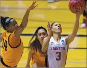  ?? STEPHEN SPILLMAN — THE ASSOCIATED PRESS ?? Stanford guard Anna Wilson, right, scores past Oklahoma State forward Taylen Collins during the first half of Tuesday night’s NCAA Tournament second-round game.