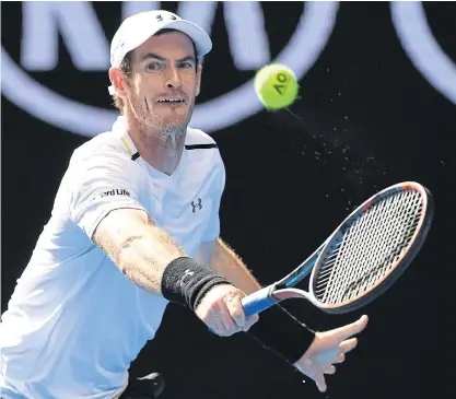  ??  ?? Andy Murray hits a return against Sam Querrey during their third round match.