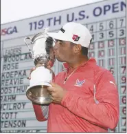  ?? AP Photo/CAROLYN KASTER Gary Woodland poses with the trophy after winning the U.S. Open Championsh­ip golf tournament Sunday in Pebble Beach, Calif. ??