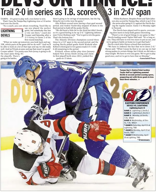  ?? AP ?? Tampa Bay’s Ondrej Palat tackles Taylor Hall as Lightning pummel Devils in second period scoring spree, peppering net with three goals in less than three minutes.