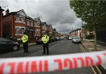  ?? BEN STANSALL/AFP/GETTY IMAGES ?? British police raided a northwest London home that had been under observatio­n as part of an anti-terrorism probe.