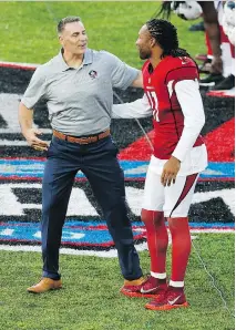  ?? THE ASSOCIATED PRESS ?? Former St. Louis Rams and Arizona Cardinals quarterbac­k Kurt Warner, left, had a great connection with Larry Fitzgerald during his playing days, and is now a member of the Pro Football Hall of Fame.