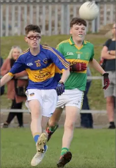  ??  ?? Adam Lambert of St. Mary’s (Rosslare) kicks for goal despite the best efforts of Joseph Rossiter (Blackwater).