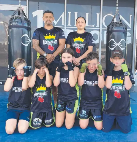  ?? ?? Young fighters from around Townsville are primed for the NQ titles at the PCYC Aitkenvale on Saturday. Back row (from left): Derek Webber, Sahara Dempsey. Front row: Peter Brock, Hunter Webber, Lilly Brock, Wyatt Brock and Memphis Watts. Picture: Patrick Woods