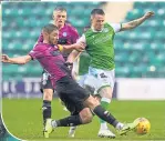  ??  ?? St Mirren’s Sam Foley tackles Marc McNulty