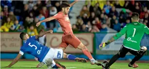  ?? AFP ?? Real’s Marco Asensio (centre) vies for the ball with Melilla’s Mohamed Mahanan and Dani Barrio. —