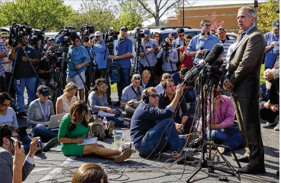  ??  ?? ATF Special Agent in Charge Fred Milanowski (right) speaks during a news conference Wednesday in Pflugervil­le after the bombing suspect killed himself in his SUV. Milanowski said agents found homemade explosives and bomb components in a room of the...