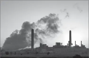  ?? AP Photo/J. David Ake ?? Coal Power: In this July 27, 2018 photo, the Dave Johnson coal-fired power plant is silhouette­d against the morning sun in Glenrock, Wyo. The Trump administra­tion on Tuesday proposed a major rollback of Obamaera regulation­s on coal-fired power plants, striking at one of the former administra­tion’s legacy programs to rein in climate-changing fossil-fuel emissions.