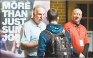  ?? Jeff Morehead / Associated Press ?? Recruiters speak to students and other visitors during the Experience Indiana job fair event in the student center at Indiana Wesleyan University.