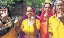  ?? AFPI ?? Women show their inked fingers after casting their vote at a polling station in Gurgaon on Sunday.