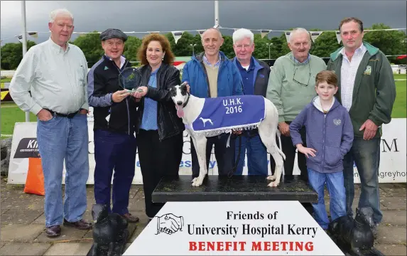  ??  ?? Bríd Rusk, representi­ng the sponsors, presents the winner’s trophy to winning Joint owner Berkie Browne after Ill Be King won the Institute of Technology Tralee Stakes 525 Final at the recent University Hospital Kerry benefit night. Included, from...