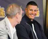  ?? K.C. Alfred/TNS ?? San Diego Padres’ Manny Machado smiles as owner Peter Seidler speaks during a news conference to announce Machado’s contract extension on Tuesday in Scottsdale, Ariz.