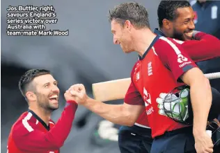  ??  ?? Jos Buttler, right, savours England’s series victory over Australia with team-mate Mark Wood