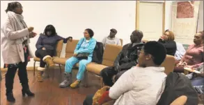  ?? Clarice Silber / CTMirror.org ?? Community organizer Tieasha Gayle speaks to Barbour Gardens tenants in Hartford. last week.