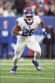  ?? Steve Luciano / Associated Press ?? New York Giants running back Saquon Barkley in action against the Philadelph­ia Eagles on Nov. 28.