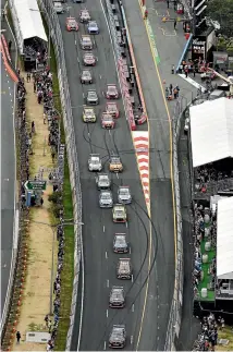  ?? LANCE SMITH PHOTO: GETTY IMAGES ?? Paul Dumbrell leads Alex Premat at the start of the Supercars Gold Coast 600 yesterday.