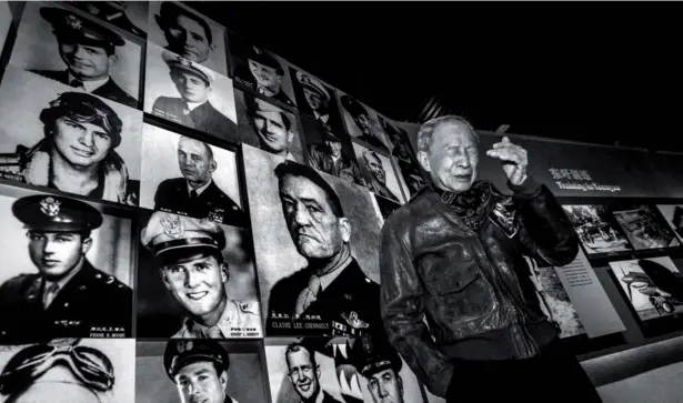  ?? PHOTOS BY LIU HANG / PROVIDED TO CHINA DAILY ?? Chen Bingjing (pictured at the age of 94), one of the first 12 Chinese pilots to join the US Flying Tigers. He bursts into tears in front of the big picture of Commander Claire Lee Chennault and his comrades exhibited in the Kunming Flying Tigers...