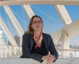  ?? Photo by Dani Machlis/BGU ?? DR. STAV ROSENZWEIG, pictured here on the bridge leading to the University's hi-tech park, discovered that Israelis buying hybrid cars does not solve the pollution problem because they drive more.