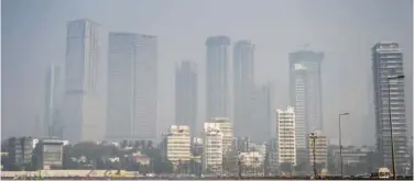  ?? Agence France-presse ?? ↑
This photograph taken on Tuesday shows the city skyline on a hazy afternoon in Mumbai.