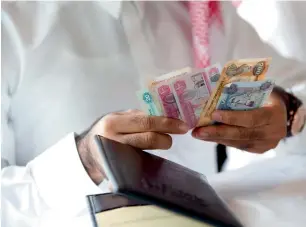  ?? — Getty Images ?? Deposits held by Islamic banks amounted to Dh392.4 billion, making up 23.3 per cent of total deposits held by UAE banks, estimated at around Dh1.7 trillion by the end of June.