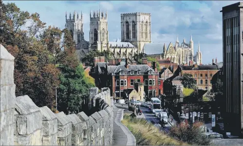  ??  ?? York Minster seen from the city walls. The city’s combinatio­n of historic heritage and modern outlook has seen it named the best place to live in Britain.