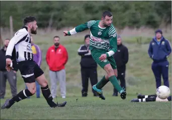  ??  ?? Luke Lacey of Ballymurn Celtic is chased by Seán O’Shea of Ajax Athletic during their Wexford Football Division 3A match on Sunday.