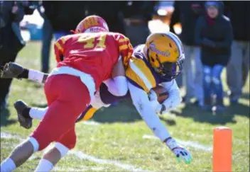  ?? ERIC HARTLINE — FOR DIGITAL FIRST MEDIA ?? Upper Darby’s Shawn McCullough dives for the pylon and scores on a 16-yard touchdown catch despite the defensive effort of Haverford’s Justin Burgess in the second quarter Thursday.