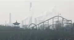  ?? REUTERS ?? Cooling towers emit steam and chimneys billow in an industrial zone in Wu’an, Hebei province, China.