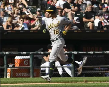  ?? DAVID BANKS — THE ASSOCIATED PRESS ?? The A’s Chad Pinder, who gave Chapman a razor haircut on Friday, runs the bases after belting a two-run home run.