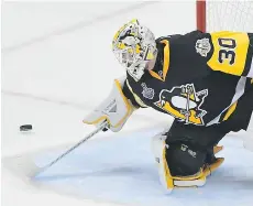  ?? MATT KINCAID/GETTY IMAGES ?? Pittsburgh Penguins goaltender Matt Murray, seen attempting to make a save against the Nashville Predators on Wednesday in Pittsburgh, is “going to make some noise in the records for sure,” his former coach Rick Evoy says.