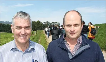  ??  ?? Dr Bob Farquharso­n (left) from Melbourne University joins Agircultur­e Victoria’s Dr Martin Auldist to assist Bachelor of Science and Bachelor of Agricultur­e students duirng their visit to Ellinbank Research Centre recently.