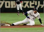  ?? EUGENE HOSHIKO — THE ASSOCIATED PRESS ?? Shohei Ohtani of Japan slides into second base during a Pool B game against the Czech Republic on Saturday at the World Baseball Classic in Tokyo.