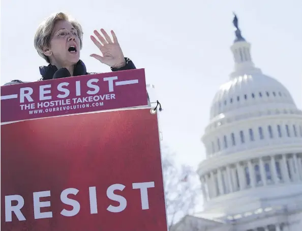 ?? ALEX WONG/GETTY IMAGES ?? Sen. Elizabeth Warren speaks during a rally in front of the U.S. Capitol on Wednesday in Washington. Democrats are opposing the nomination of Jay Clayton to head the Securities and Exchange Commission over his extensive ties to Goldman Sachs and other...