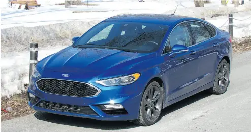  ?? COSTA MOUZOURIS / DRIVING. CA ?? The 2017 Ford Fusion Sport boasts 325 horsepower under the hood while remaining classy and refined on the outside.