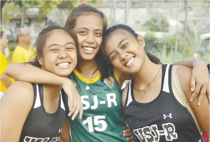  ?? SUNSTAR FOTO/ARNI ACLAO ?? CHAMPIONS. USJ-R’s Chriszelle Anne Caasi, Shantal Rodriguez and Anne Krizzia Caasi celebrate their gold medal win in the Cesafi secondary girls division.