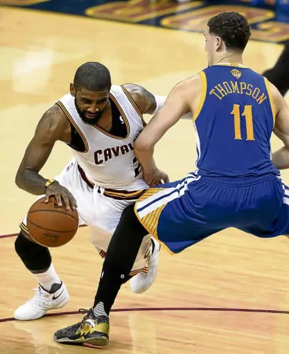  ?? AP ?? IRVING VS THOMPSON Cleveland Cavaliers guard Kyrie Irving drives on Golden State Warriors guard Klay Thompson during Game 6 of the NBA Finals in Cleveland, Ohio. They will see action again in the championsh­ip game today in Oakland, California.