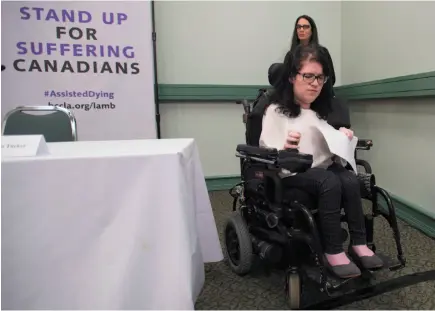  ?? CP FILE PHOTO ?? Julia Lamb, who has a degenerati­ve muscle disease, leaves a news conference in Vancouver in 2016. Lamb challenged the federal government’s assisted dying law in court.