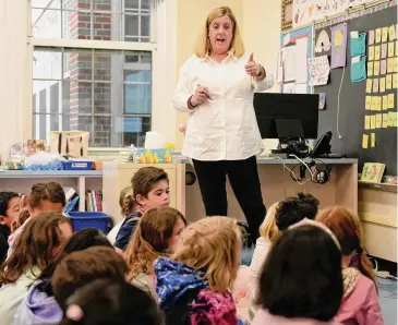  ?? Tyler Sizemore/Hearst Connecticu­t Media file photo ?? Kathleen Falla teaches her first grade class at Cos Cob School on May 2. Greenwich Public Schools put in a waiver of the state’s new “Right to Read” reading curriculum that was denied on Tuesday.