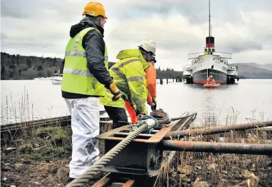  ??  ?? Long haul Unsuccessf­ul bid to pull the Maid of the Loch from the water to be subject of probe