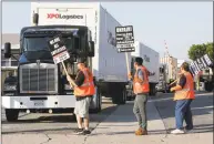  ?? Mark Boster / TNS ?? Port truck drivers picket at XPO Logistics in Commerce in 2017.