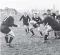  ?? PHOTO: ODT FILES ?? Glory days . . . Colin Meads passes the ball to halfback Chris Laidlaw during a test between the All Blacks and Australia at Carisbrook in 1964.