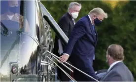  ?? Photograph: Jacquelyn Martin/AP ?? Donald Trump arrives at Walter Reed National Military Medical Center in Maryland, with Mark Meadows, on 2 October 2020.