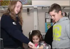  ??  ?? Kyle McGahan and his little sister Abby getting a tour of Ardee CS from Amy Doggett.