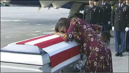  ?? AP PHOTO ?? In this frame from video, Myeshia Johnson cries over the casket of her husband, Sgt. La David Johnson, who was killed in an ambush in Niger. Sgt. Johnson’s mother said Wednesday that President Donald Trump, in a call offering condolence­s, showed...