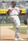  ?? Jamie Squire / Getty Images ?? Christian Vazquez of the Boston Red Sox arrives at third base for a two-run triple during the seventh inning against the Kansas City Royals at Kauffman Stadium on Thursday in Kansas City, Mo.