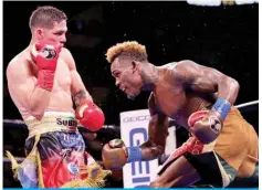  ?? — AFP ?? SAN ANTONIO: Jermell Charlo (right) and Brian Castano (left) exchange punches during their Super Welterweig­ht fight at AT&T Center on Saturday in San Antonio, Texas.