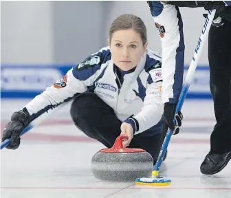  ??  ?? Kamloops skip Karla Thompson unloads her rock during a matchup against Team Donaldson on Thursday at the Victoria Curling Club.