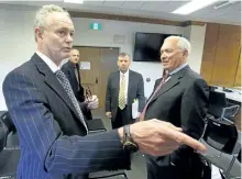  ?? CLIFFORD SKARSTEDT/EXAMINER ?? Alan Barber, the associate city lawyer for the City of Peterborou­gh, left, chats with Murray Davenport following the second day of an Ontario Municipal Board (OMB) hearing Thursday at City Hall of Davenport’s appeal of city council’s decision on the...