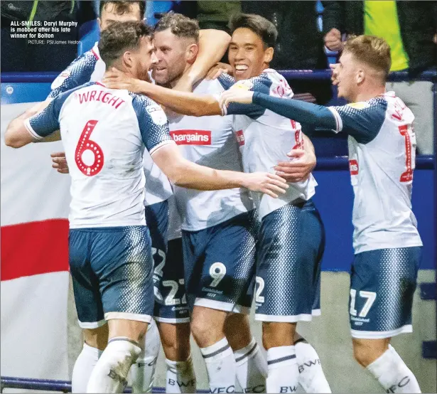  ?? PICTURE: PSI/James Heaton ?? ALL-SMILES: Daryl Murphy is mobbed after his late winner for Bolton